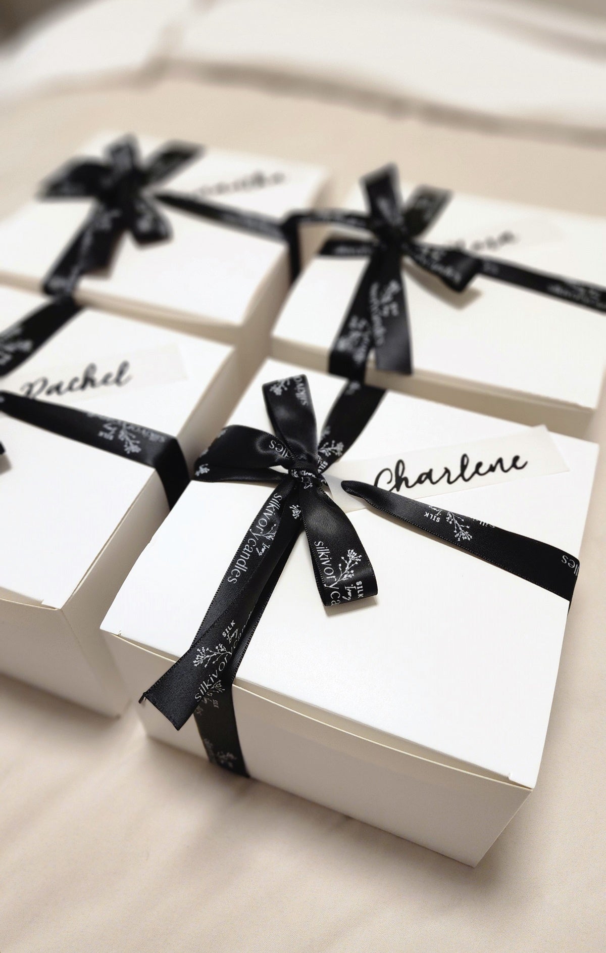 Luxury luxe white gift boxes, black ribbon, name tag