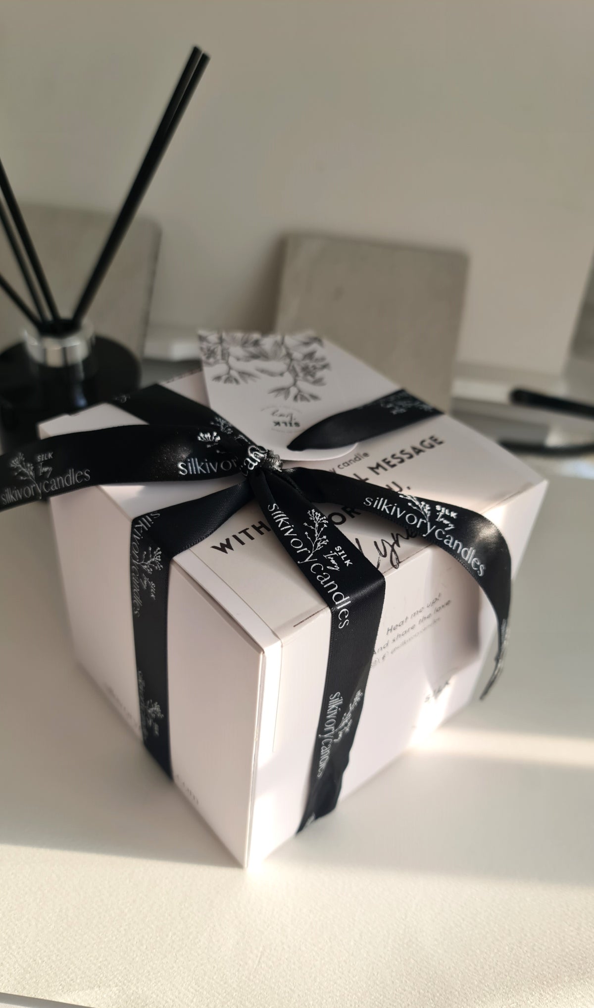 Luxury gifting_White box and black ribbon, Silk ivory candles Singapore